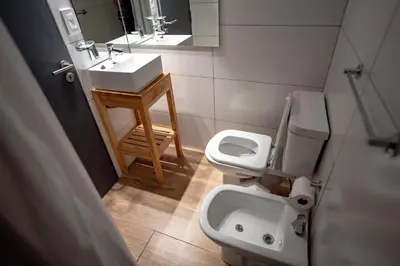 a bathroom with a sink and a toilet at Nuevo Centro Hotel Villa Carlos Paz in Villa Carlos Paz