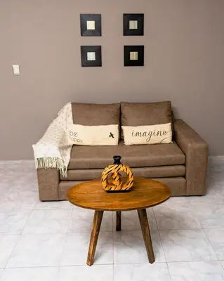 a living room with a couch and a table at Depto 5 in Villa Carlos Paz