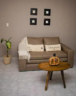 a living room with a couch and a table at Depto 5 in Villa Carlos Paz