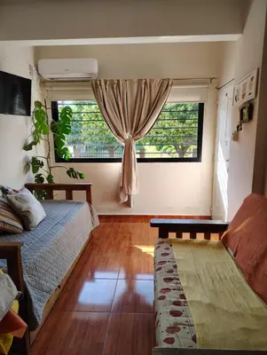 a bedroom with a bed and a window at Dpto en alquiler temporario en VCPaz in Villa Carlos Paz