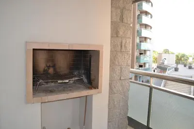 a fireplace on a wall next to a balcony at Departamento Temporario en Alto Villasol in Cordoba