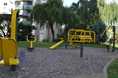 a playground with yellow play equipment in a park at Departamento Temporario en Alto Villasol in Cordoba