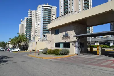 a city street with a bus stop and tall buildings at Departamento Temporario en Alto Villasol in Cordoba