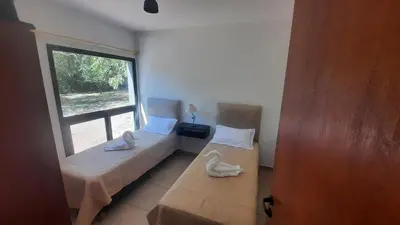 two beds in a room with swans on them at Las Toribias I in Merlo