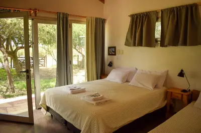 a bedroom with a bed with two towels on it at Dormis:Lodesilvi in Merlo