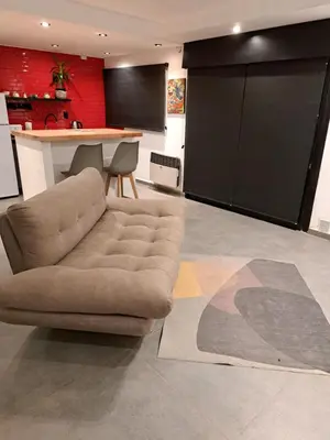 a living room with a couch and a table at Departamento Entero 2 Dormitorios B° Urca con Cochera in Cordoba