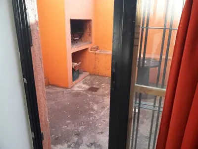 a view of a room with an orange wall at Departamento de Caroya in Villa Carlos Paz