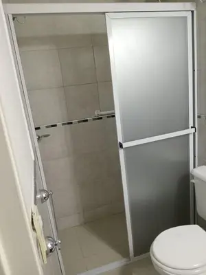 a bathroom with a shower and a toilet at Departamento de Caroya in Villa Carlos Paz