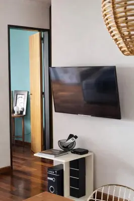 a living room with a flat screen tv on a wall at Refugio en Nueva Córdoba Excelente ubicación in Cordoba