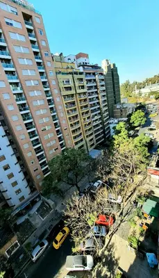 an aerial view of a parking lot with tall buildings at Refugio en Nueva Córdoba Excelente ubicación in Cordoba