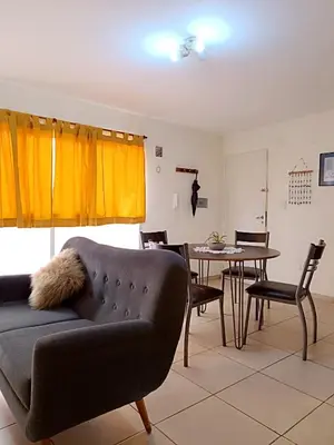 a living room with a couch and a table at La Lunita in Cordoba