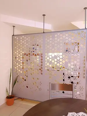 a room with a wall covered in gold sequins at La Lunita in Cordoba