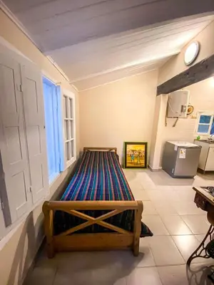 a room with a bed in a room with a window at Departamento Sofía in Tanti