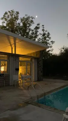 a house with a table and a swimming pool at Jauja in San Javier