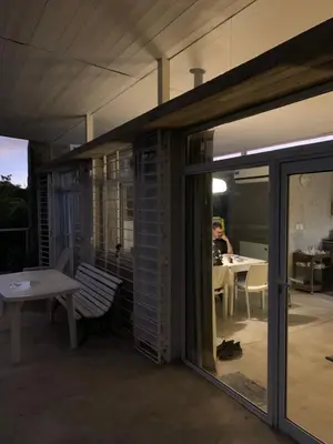 a patio with a table and a person sitting at a table at Jauja in San Javier