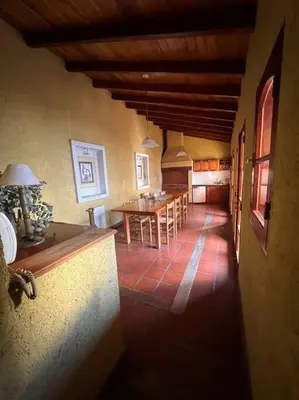 a living room with a table and a dining room at Hermosa casa en el corazón de Alta Córdoba in Cordoba