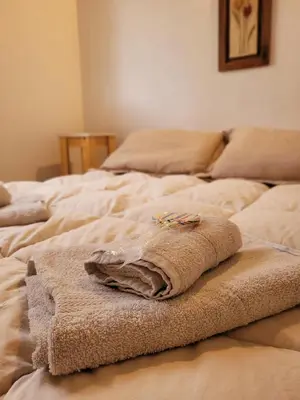 a group of beds with towels on top of them at La Algarroba in Alta Gracia