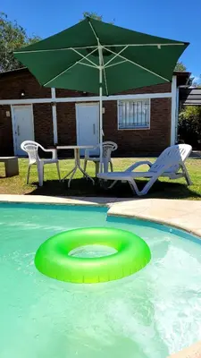 a green frisbee in the water in a pool at La Algarroba in Alta Gracia