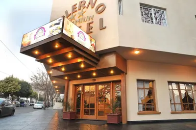a store front of a building with a sign on it at Hotel Salerno in Villa Carlos Paz