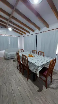 a dining room with a table and chairs at Rancho la alborada in Los Reartes
