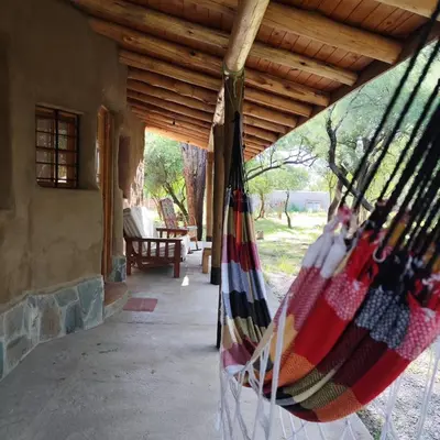 a porch of a house with a hammock at Alma de Adobe in Merlo