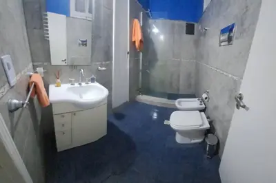 a bathroom with a white toilet and a sink at Alquiler Temporario Zona Céntrica En Córdoba in Cordoba