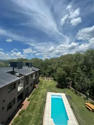 an aerial view of a house with a swimming pool at FlussHaus VGB in Villa General Belgrano