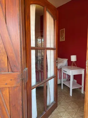 an open door to a room with a table at POSADA DEL CENTRO in Villa General Belgrano
