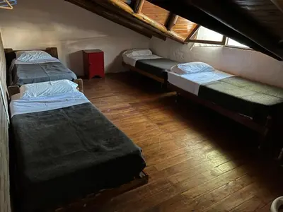 an overhead view of a room with three beds at Cabañas Los Cedros in Tanti