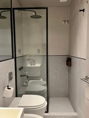 a bathroom with a toilet and a sink at Casa Papagayo in Cordoba