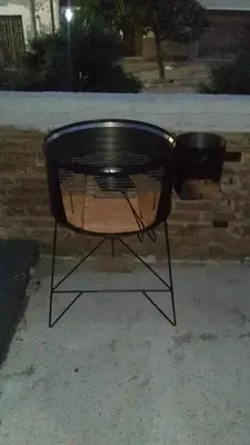 a black table sitting on top of a sidewalk at Departamento próximo terminal y hospitales in Cordoba