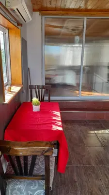 a small table with a red table cloth on it at Departamento próximo terminal y hospitales in Cordoba
