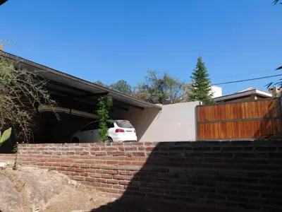 a car parked in the garage of a house at Un lugar en el mundo in Mina Clavero