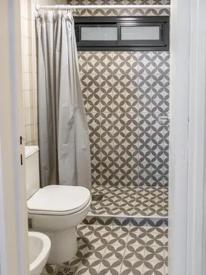 a bathroom with a toilet and a shower at Departamentos General Paz by Lugar in Cordoba