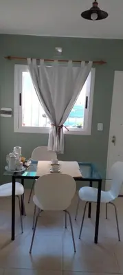 a dining room with a glass table and chairs at Das thomy in Cordoba