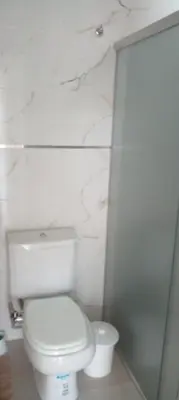 a bathroom with a toilet and a glass shower at Das thomy in Cordoba