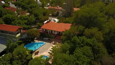 an aerial view of a house with a swimming pool at La Casa de Pipa in Mina Clavero