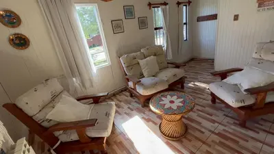 an aerial view of a living room with chairs and a table at La Casa de Pipa in Mina Clavero