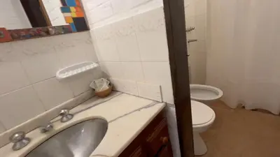 a bathroom with a sink and a toilet at La Casa de Pipa in Mina Clavero