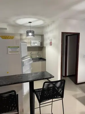 a kitchen with two chairs and a counter in a room at Veneto Village in Villa Parque Siquiman