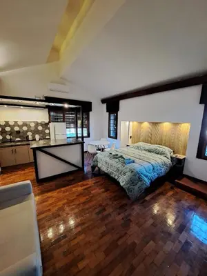 a bedroom with a large bed in a room at Loft B° Urca con cochera in Cordoba