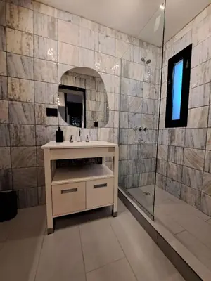 a bathroom with a sink and a shower at Loft B° Urca con cochera in Cordoba