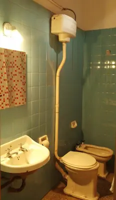 a bathroom with a toilet and a sink at El Estudio in Cordoba