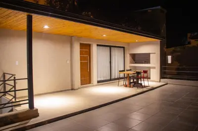 a balcony with a table and chairs on a house at TERRA CIMINTO in Villa Rumipal