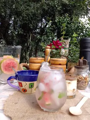 a table with several glass vases and a cup at Casa Villa Alba Carpinteria in Carpintería