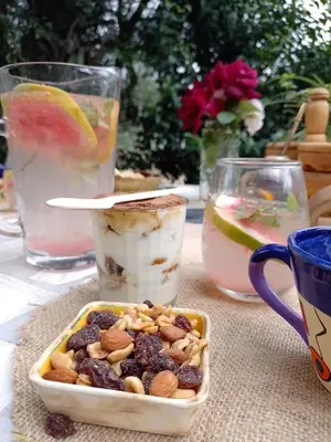 a table topped with a bowl of nuts and drinks at Casa Villa Alba Carpinteria in Carpintería