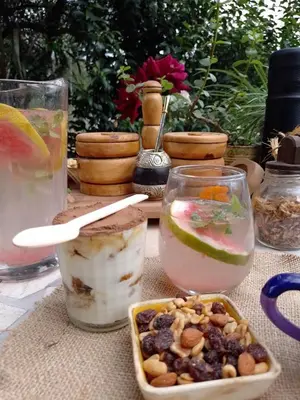 a table with a bowl of food and glasses of water at Casa Villa Alba Carpinteria in Carpintería