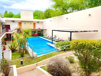 an aerial view of a house with a swimming pool at Hosteria Aguaribay in Mina Clavero