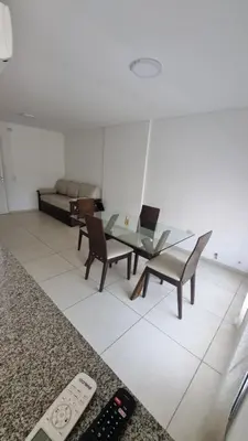 a living room with a table and chairs and a couch at Hermoso departamento temporario en zona centro a metros de la terminal e importantes hospitales in Cordoba