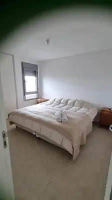 a bedroom with a large bed in a room at Hermoso departamento temporario en zona centro a metros de la terminal e importantes hospitales in Cordoba